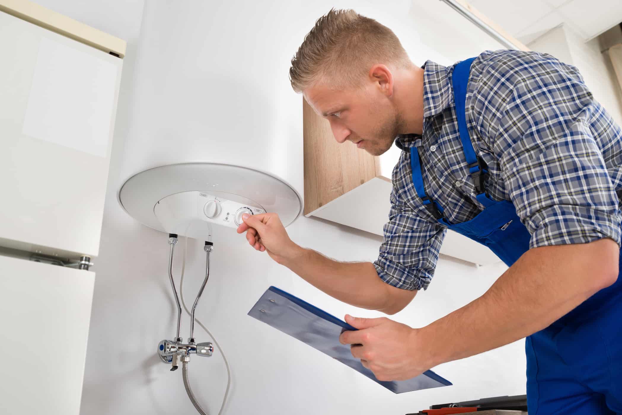 services-04 plumber-adjusting-water-heater